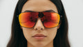Close-Up of Woman Wearing Red Mirror Shield Sunglasses – Futuristic Fashion Eyewear