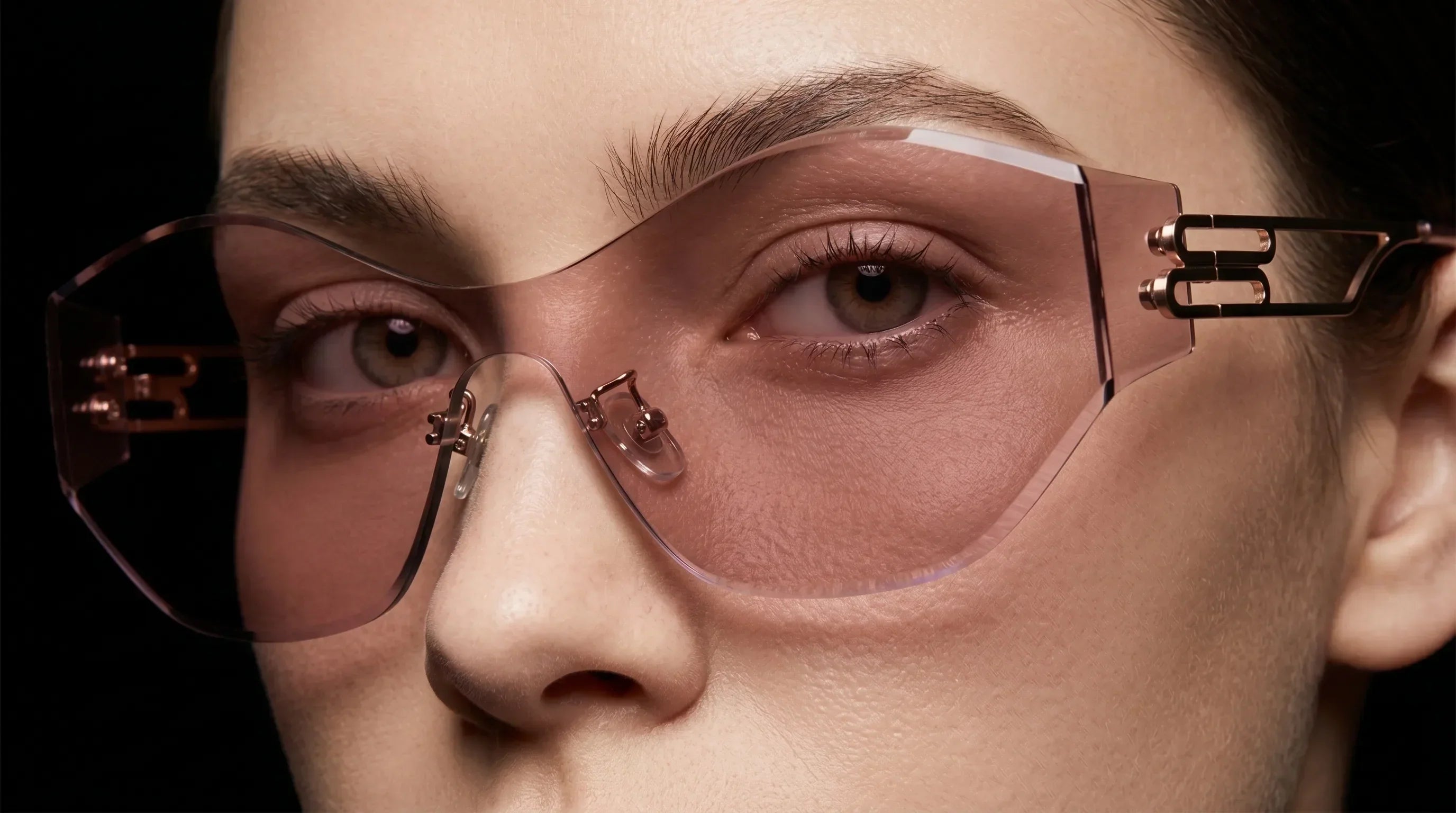 Woman wearing rimless shield sunglasses with lightweight coverage and a cleaner open face look