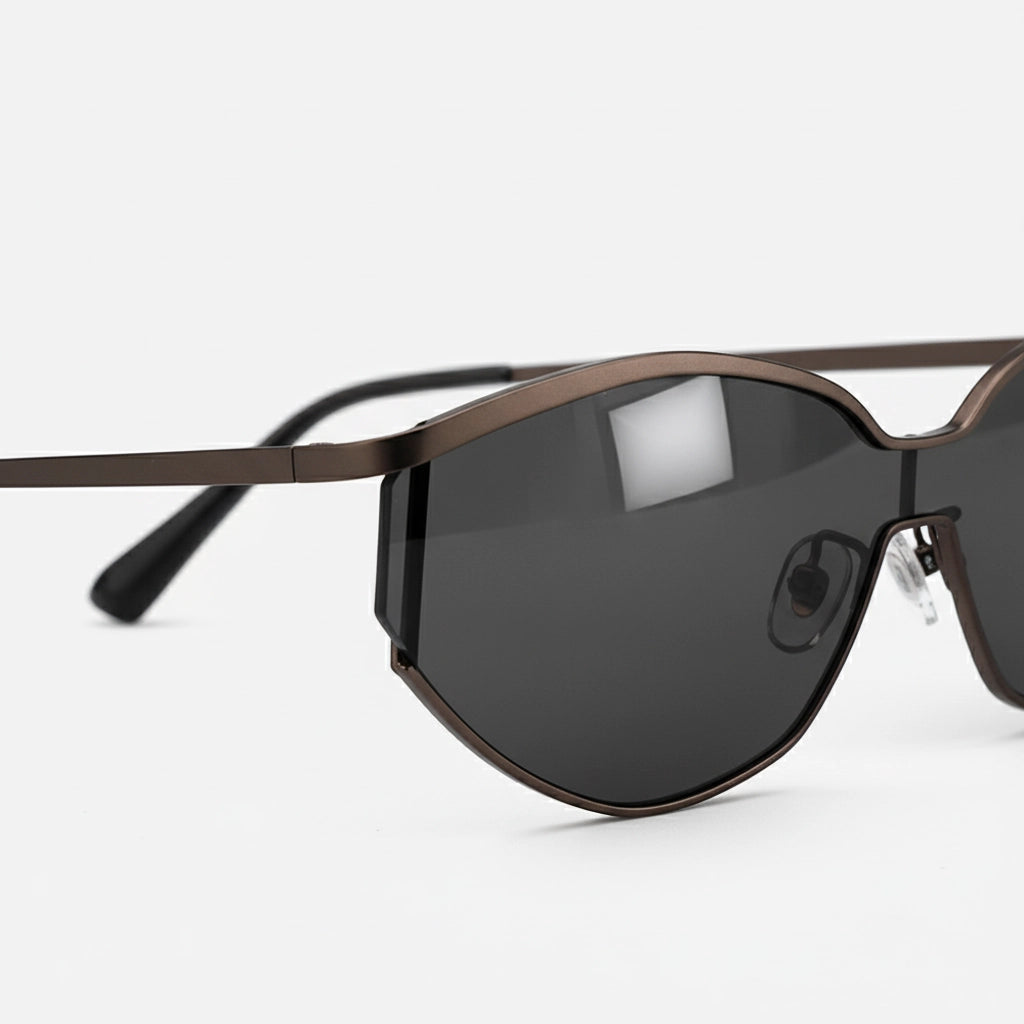 Metallic gunmetal black half-rim cat-eye sunglasses side view floating product photography