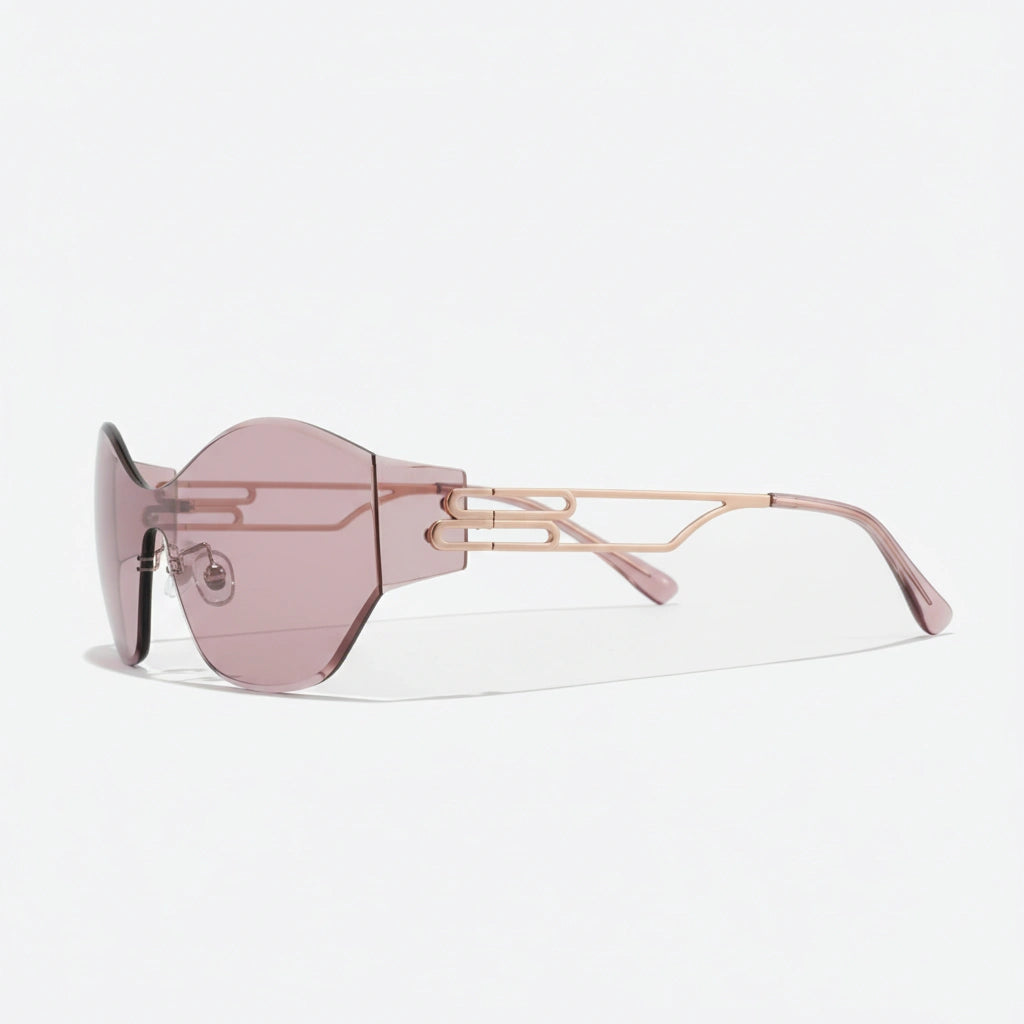 Frameless pink shield sunglasses highlighted by rose gold structural details, emphasizing a minimalist yet striking aesthetic ideal for statement styling.