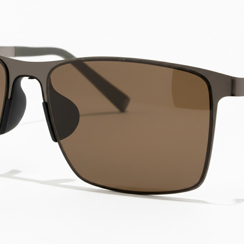 Sunglasses with brown lenses on a white background