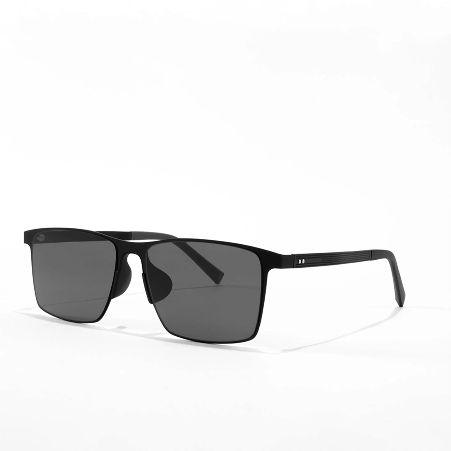 Black sunglasses with dark lenses on a white background