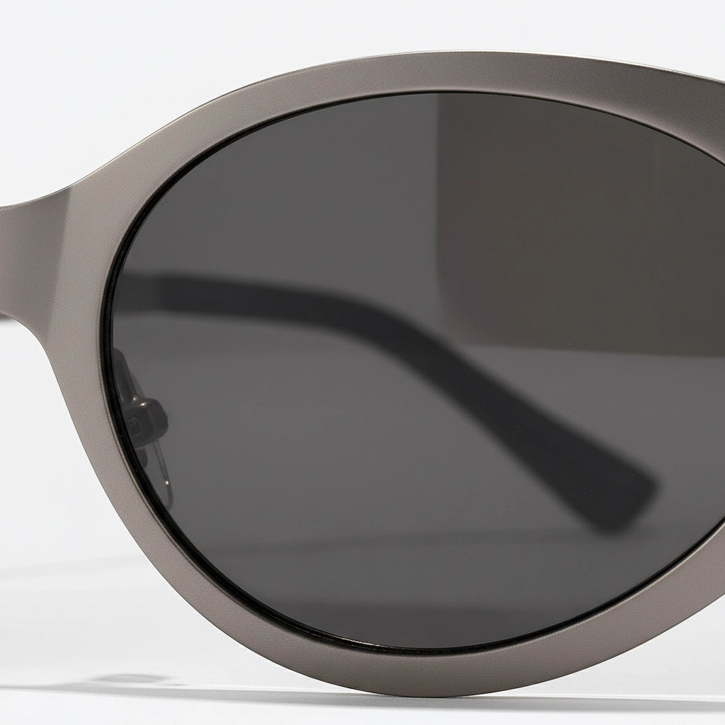 Sunglasses with dark lenses and a metallic frame on a white background