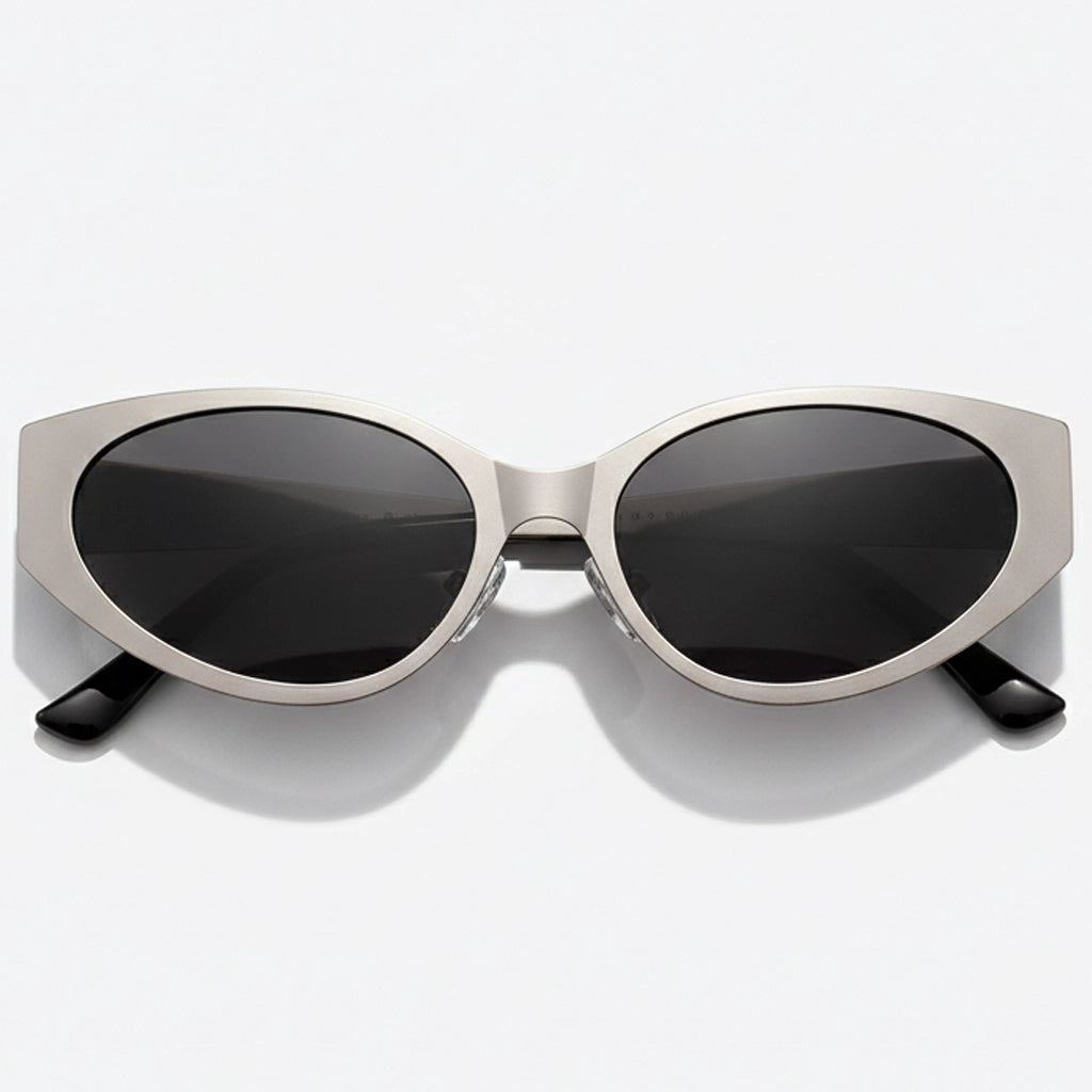 Sunglasses with a metallic frame and black lenses on a white background