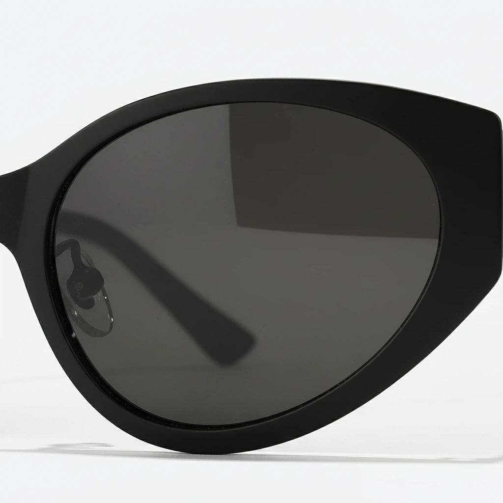 Black sunglasses with dark lenses on a white background