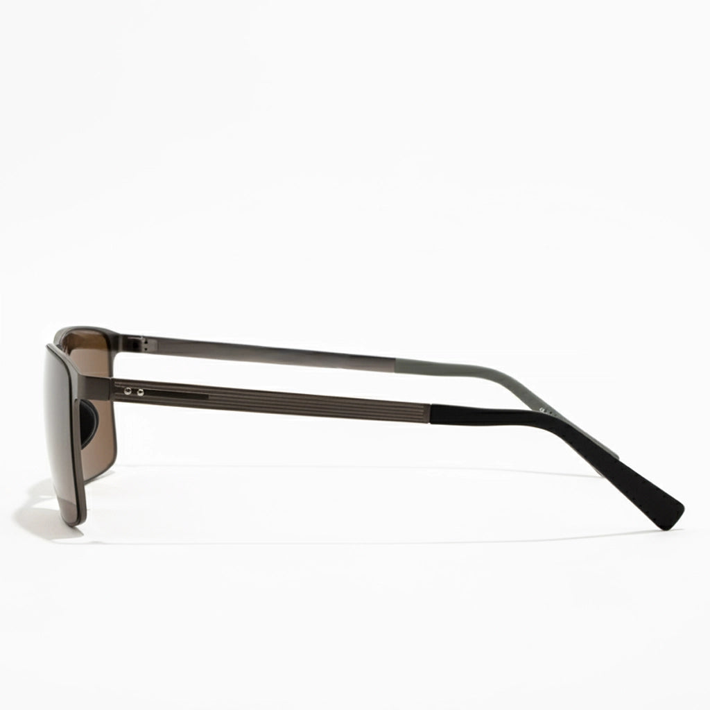 Sunglasses with a black frame and dark lenses on a white background