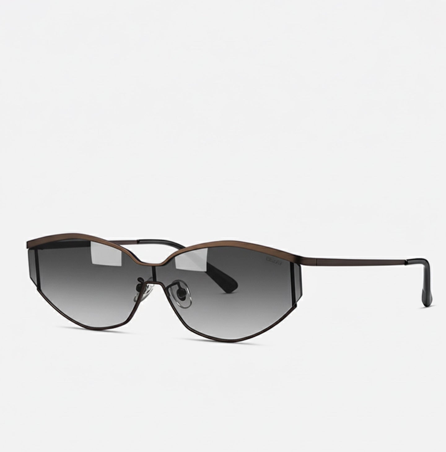 Side angle of fashionable cat-eye sunglasses showcasing a slim brown metal frame and gradient gray lenses.