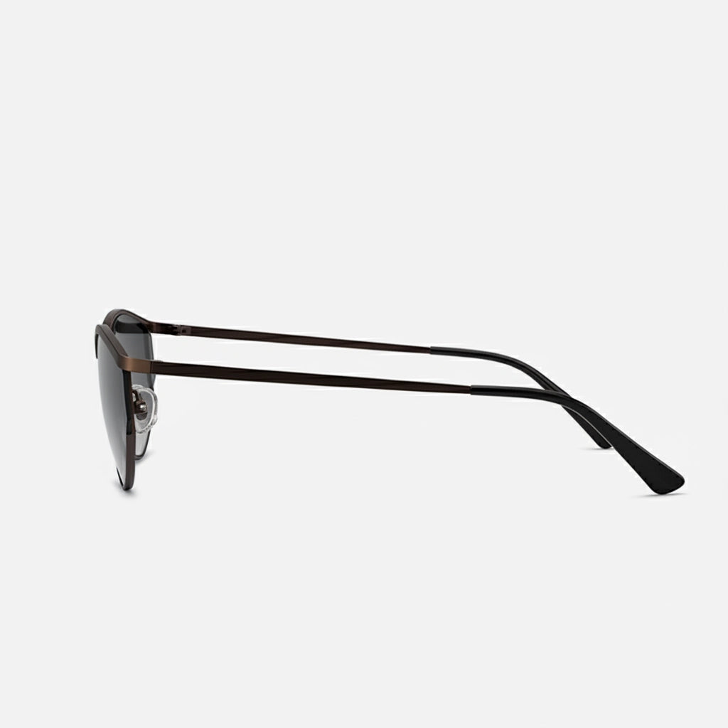 Side angle of fashionable cat-eye sunglasses showcasing a slim brown metal frame and gradient gray lenses.