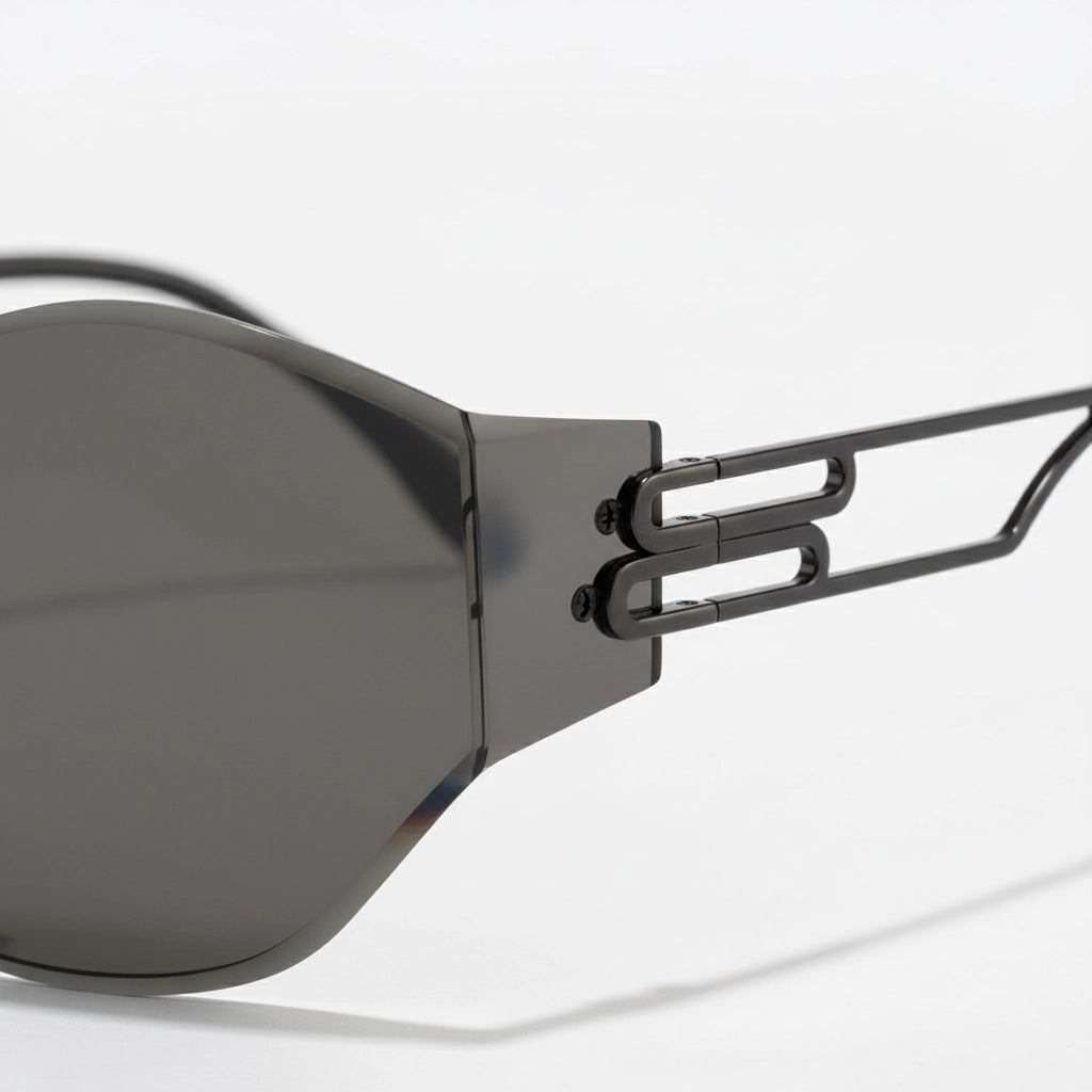 details product shot of BAPORSSA's 'Future' wavy rimless shield sunglasses in gunmetal gray, on a white background with the Baporssa logo