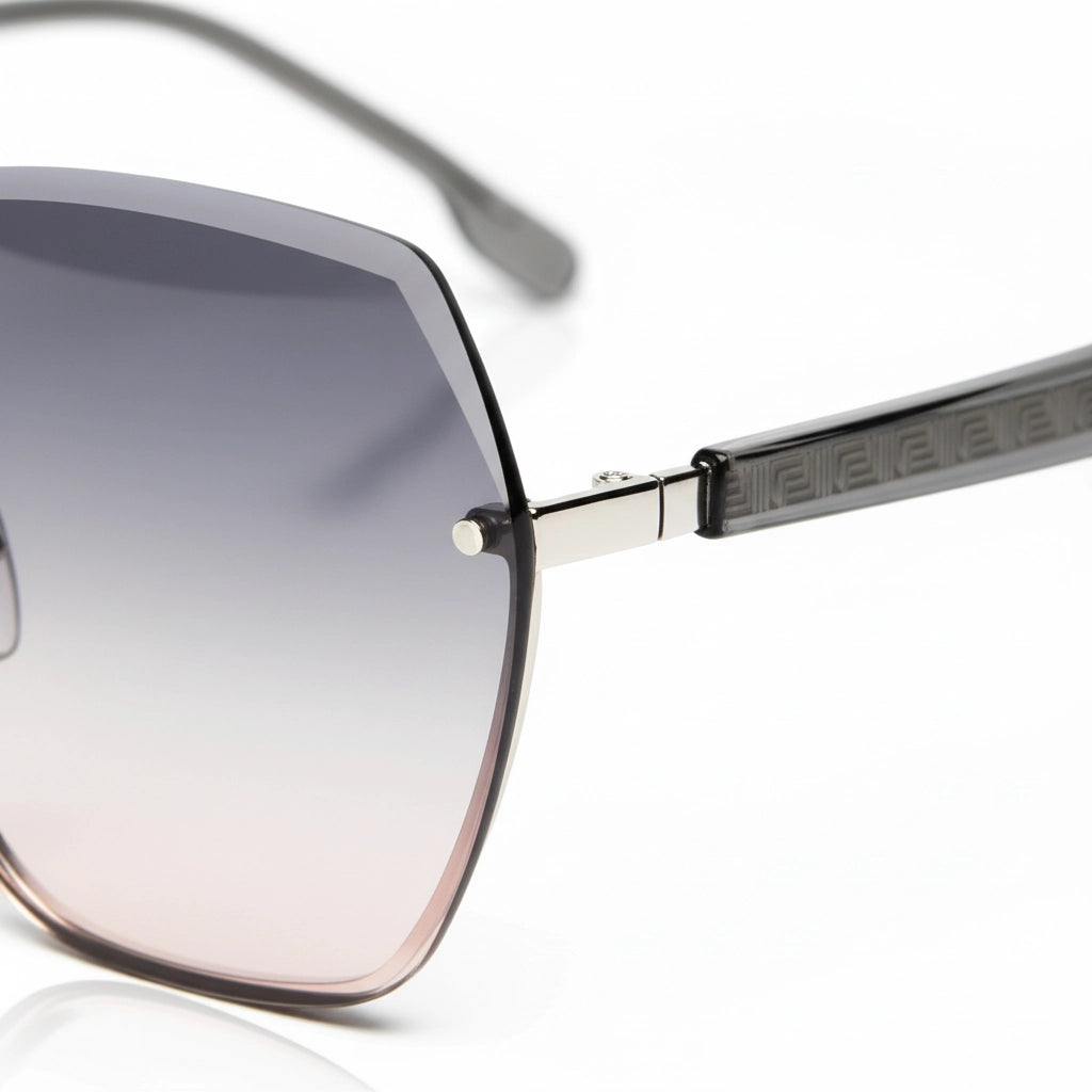 Close-up of rimless sunglasses hinge and Greek key pattern titanium temple