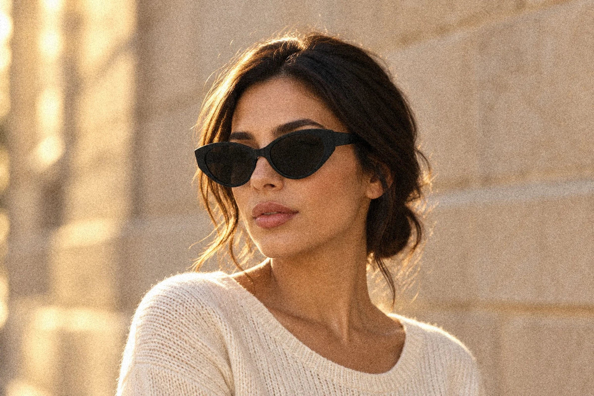 Woman wearing BAPORSSA Lyra acetate cat-eye sunglasses in Black