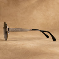 Side view of BAPORSSA Aurelia sunglasses with gunmetal metal temple, logo detail, black temple tips, and lightweight frame design