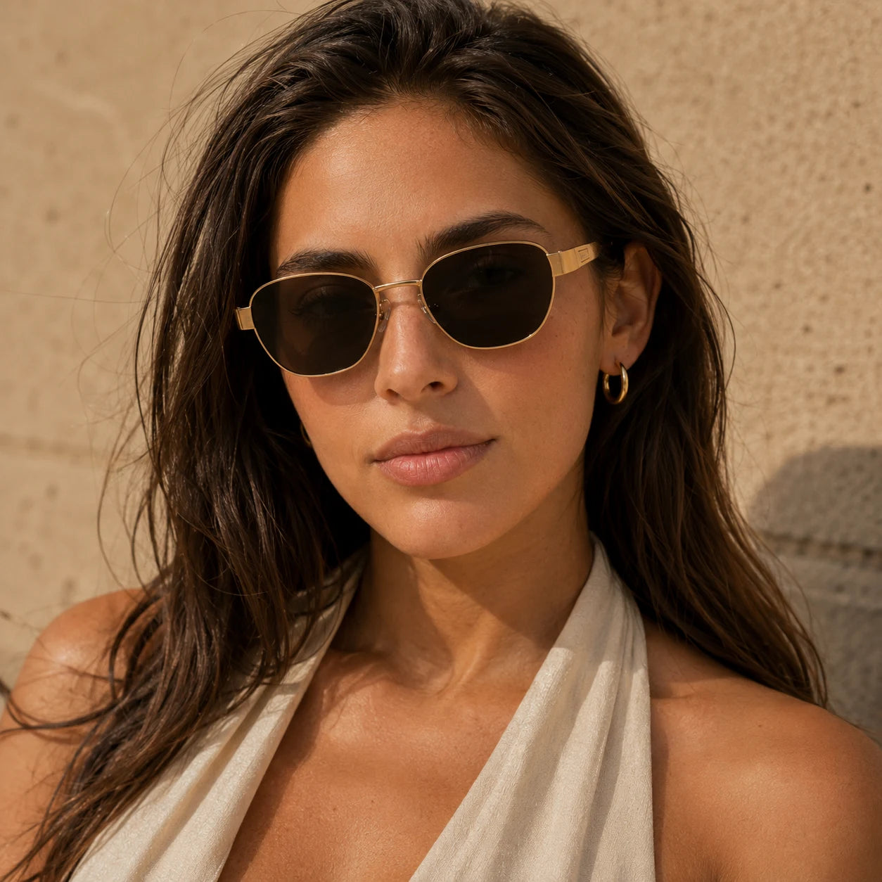 Woman wearing BAPORSSA Aurelia vintage cat-eye sunglasses showing a cleaner polished face look in warm daylight