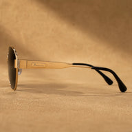 Side view of BAPORSSA Aurelia sunglasses showing slim gold metal temple, logo plate, black temple tips, and lightweight frame design