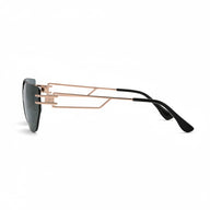 Sunglasses with a rose gold frame and black arms on a white background