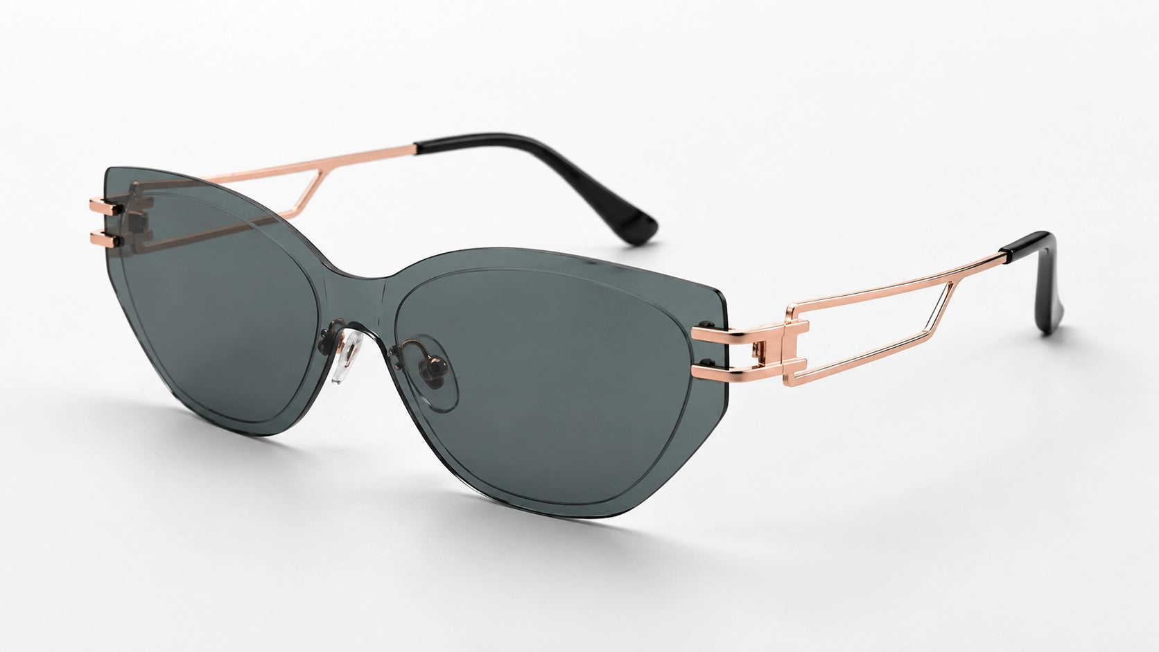 Professional studio shot of BAPORSSA Edge sunglasses with smoke grey
     cat-eye lenses and architectural rose gold temples on a white background