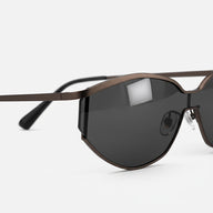 Metallic gunmetal black half-rim cat-eye sunglasses side view floating product photography