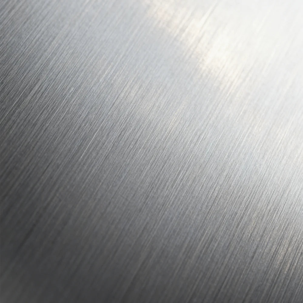 A close-up of a brushed metal texture, showcasing its fine linear grain and sleek, matte-sheen appearance—ideal for high-end product design (e.g., eyewear frames, automotive parts).