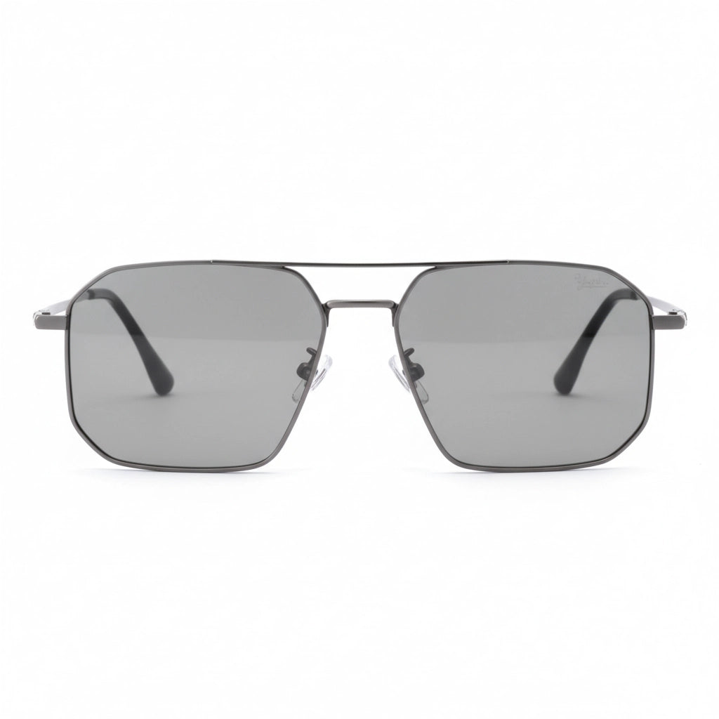 Sunglasses with a metallic frame and dark lenses on a white background