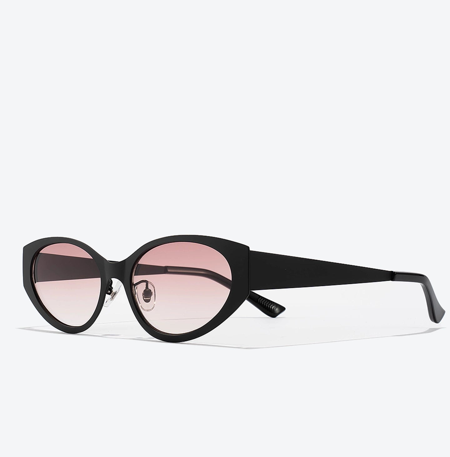 Black sunglasses with pink lenses on a white background