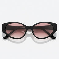 Black cat-eye sunglasses with pink lenses on a white background