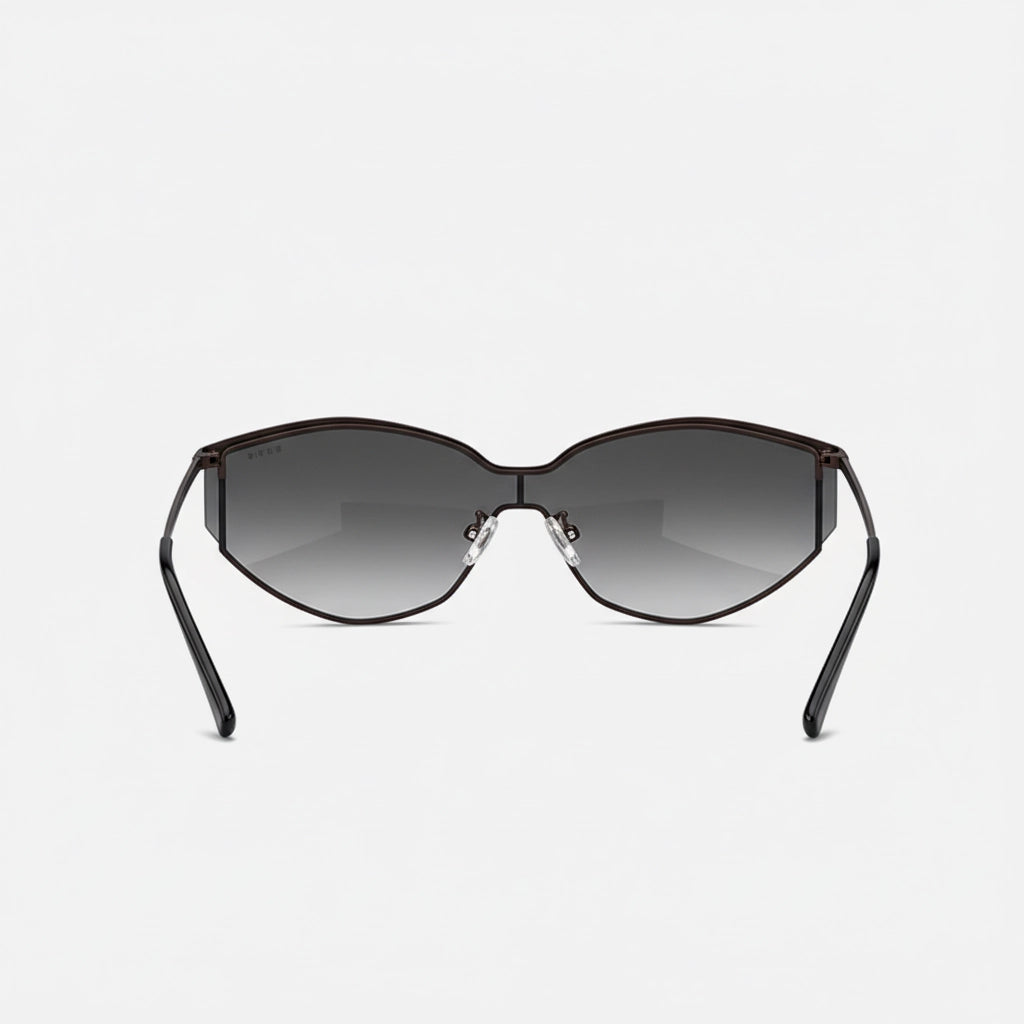 Rear perspective of trendy cat-eye sunglasses highlighting the back of the brown metal frame and gradient lenses.