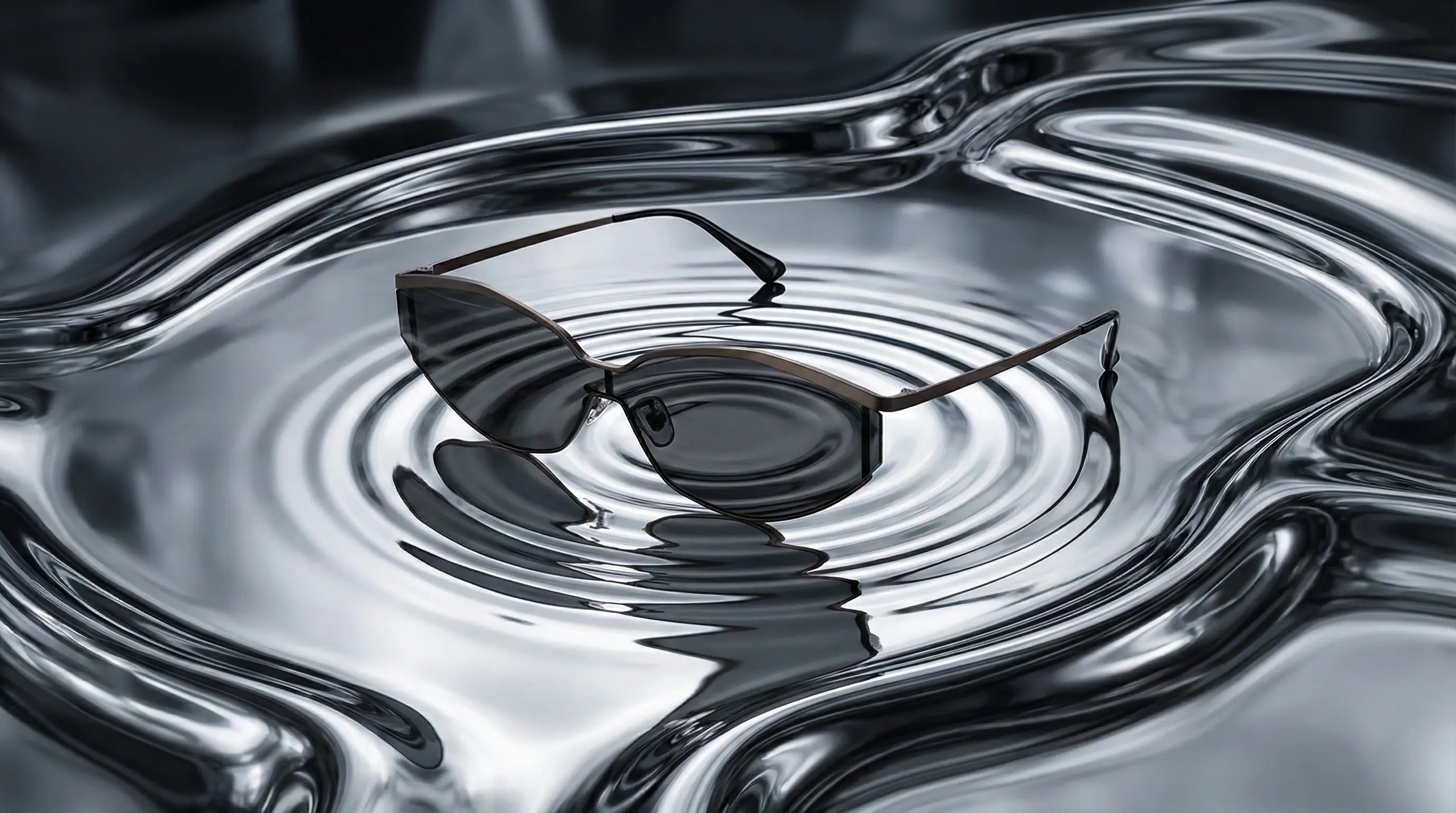 Sleek polarized sunglasses floating on water, durable and glare-blocking for outdoor use.