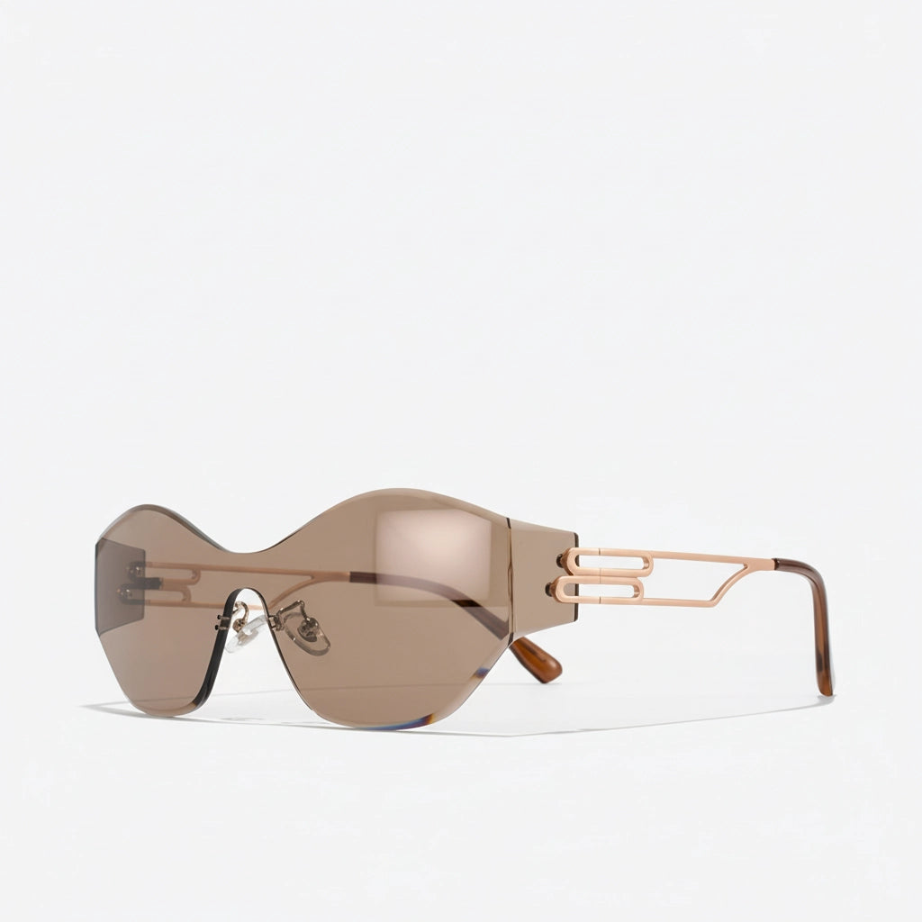 Close-up rose-gold hardware and tortoiseshell temples on iced coffee rimless sunglasses