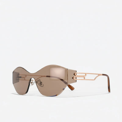 Close-up rose-gold hardware and tortoiseshell temples on iced coffee rimless sunglasses