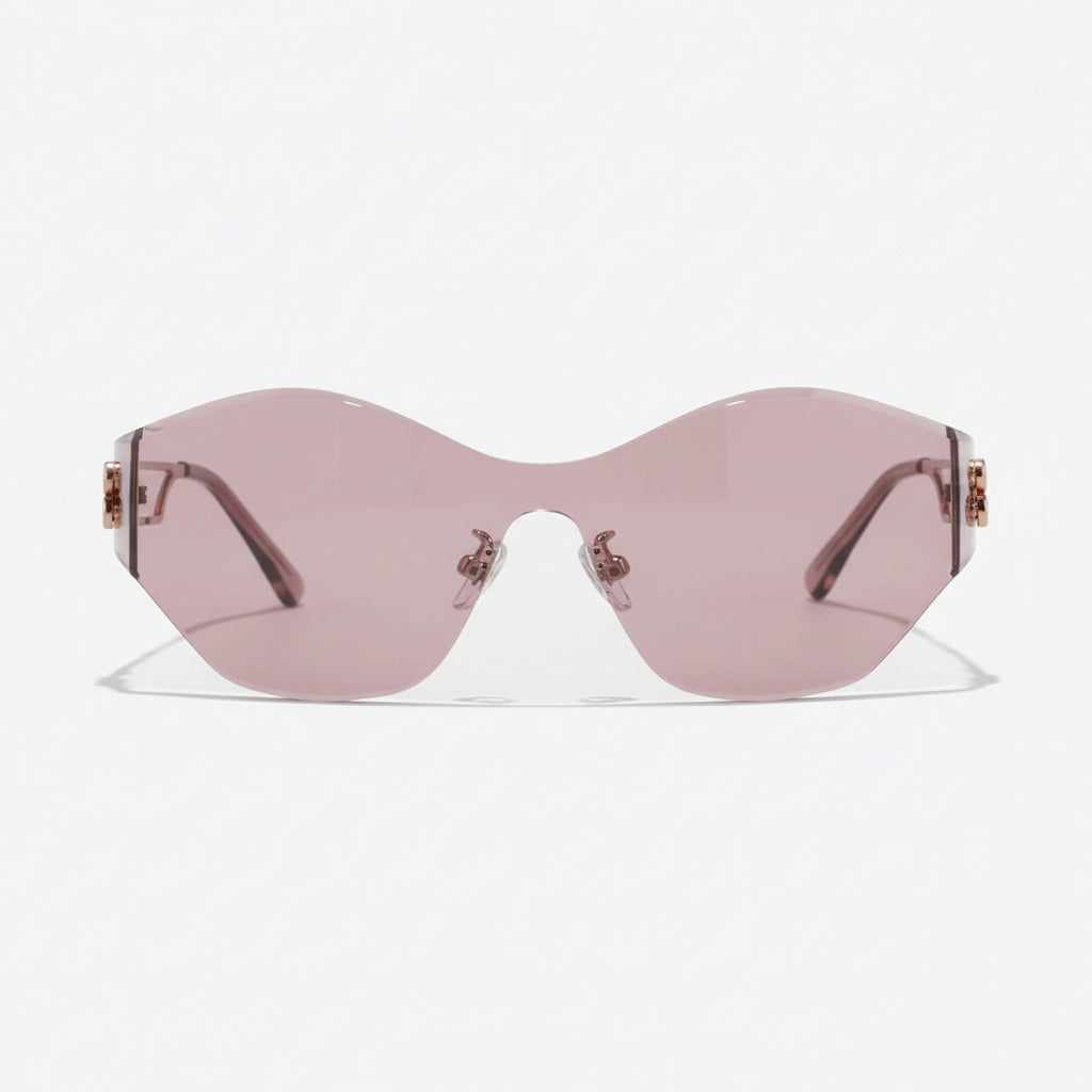 A pair of frameless translucent pink shield sunglasses, featuring sleek rose gold hardware—designed for contemporary style and lightweight all-day wear.