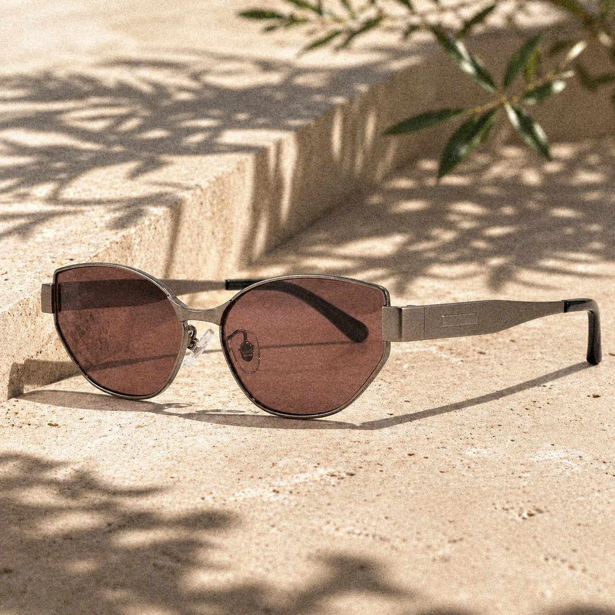 BAPORSSA Onyx sunglasses in Claret on sunlit stone