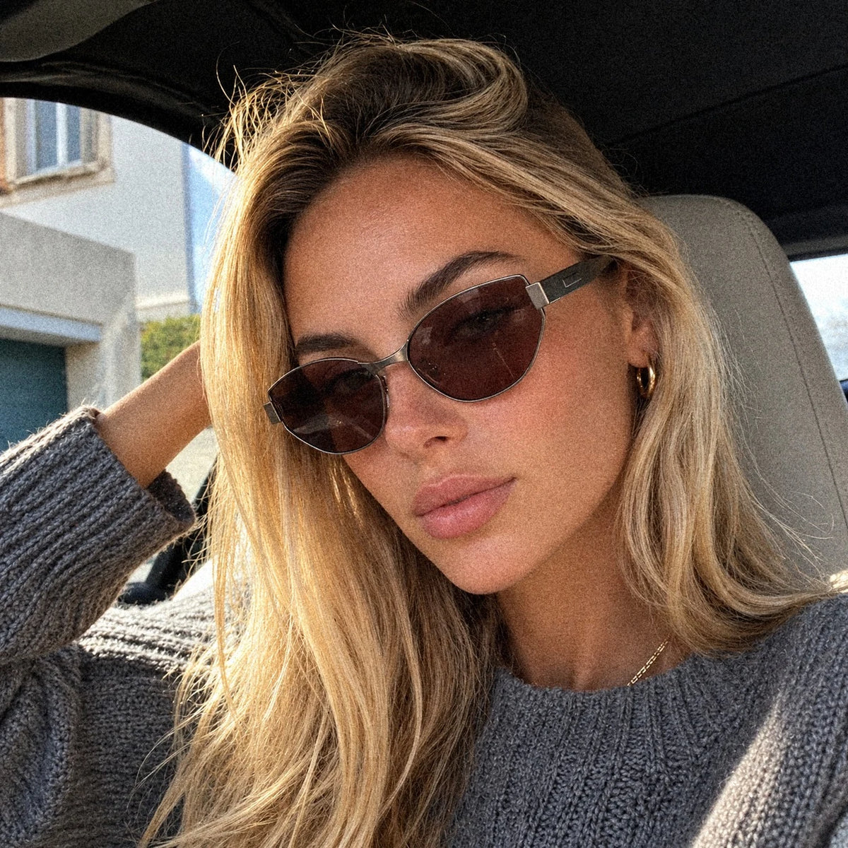 BAPORSSA Onyx sunglasses in Claret, worn on a drive