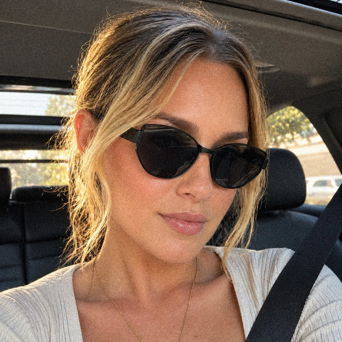BAPORSSA Onyx sunglasses in Black, worn on a drive