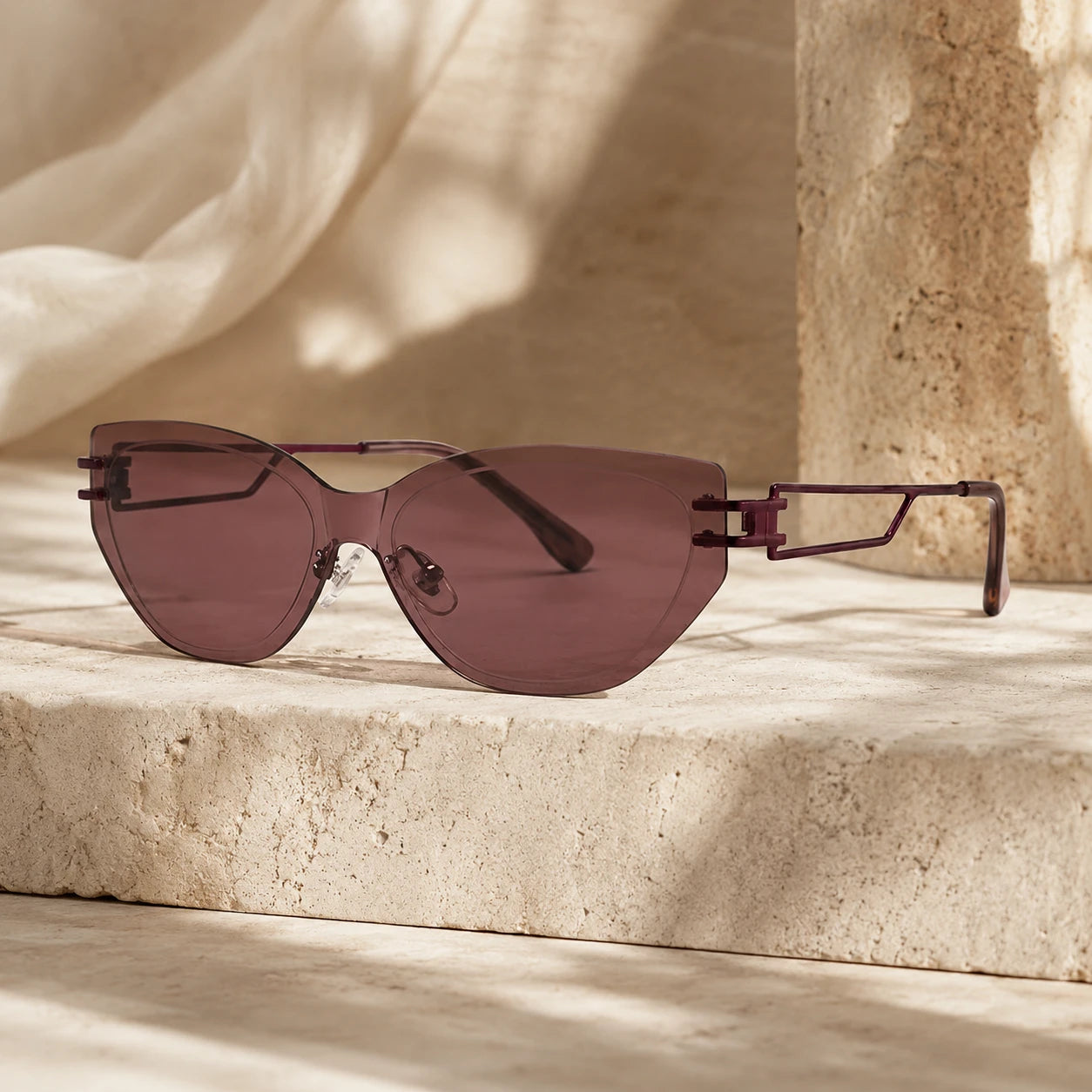 BAPORSSA edge burgundy lens rimless sunglasses still life