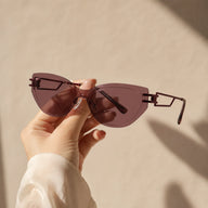 BAPORSSA edge plum geometric sunglasses hand held shot