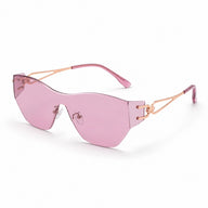 BAPORSSA Flow rimless shield sunglasses with pink lenses and rose gold geometric temples, shown in angled view on a clean white background.