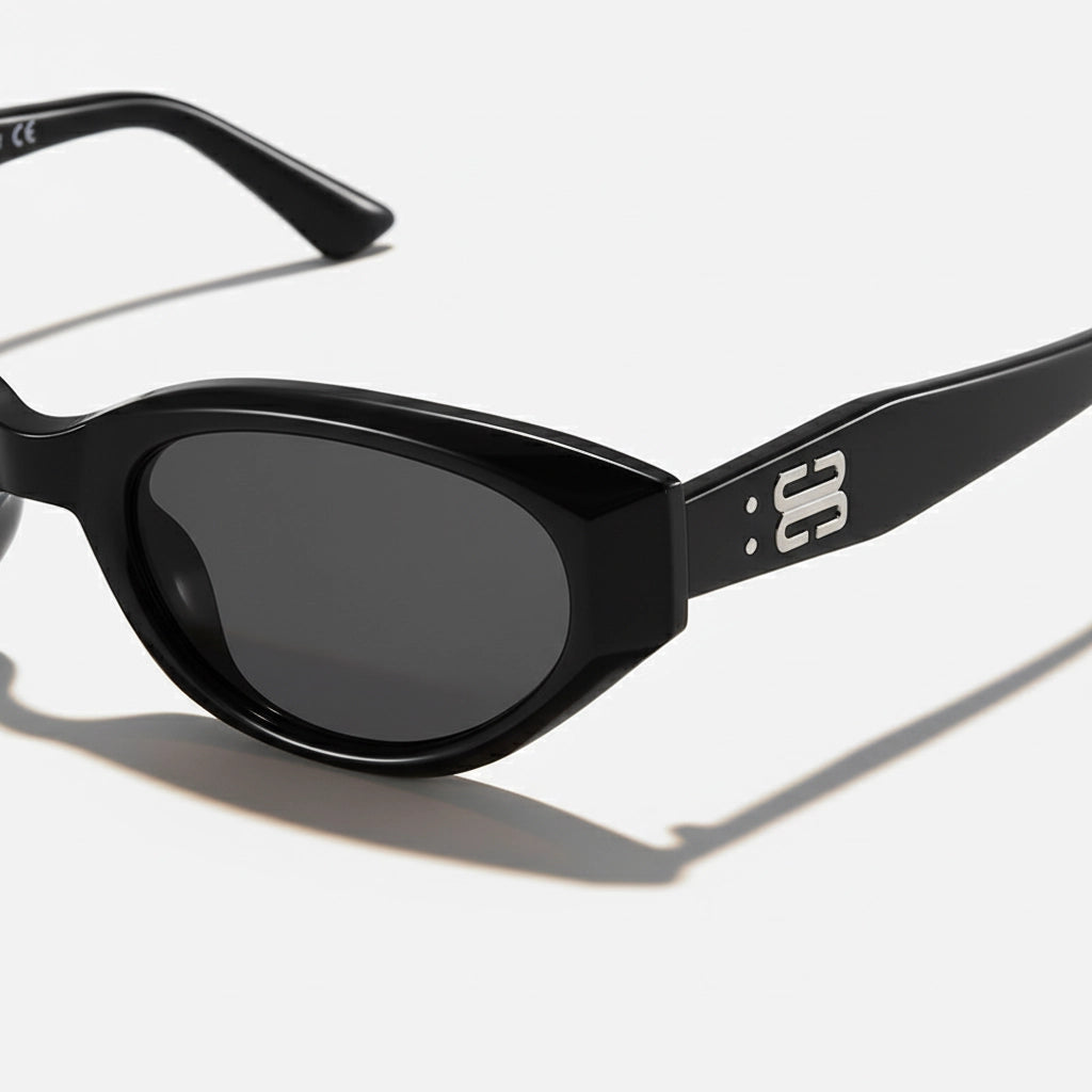 Close-up temple detail of cat-eye sunglasses, black acetate with silver BB metal logo