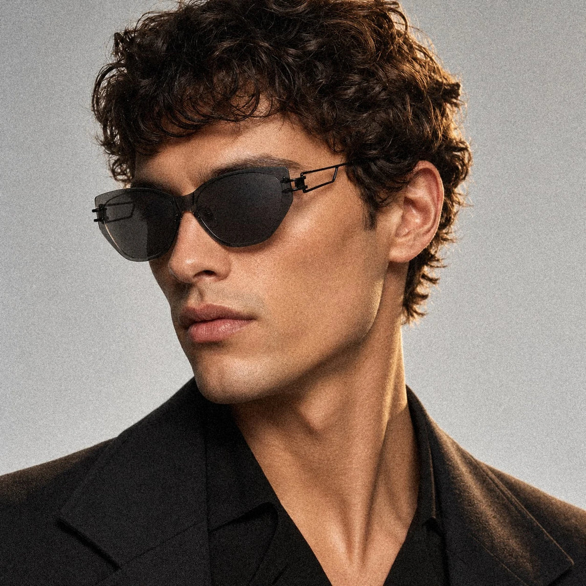 BAPORSSA Edge sunglasses in Black, worn by a male model, side profile