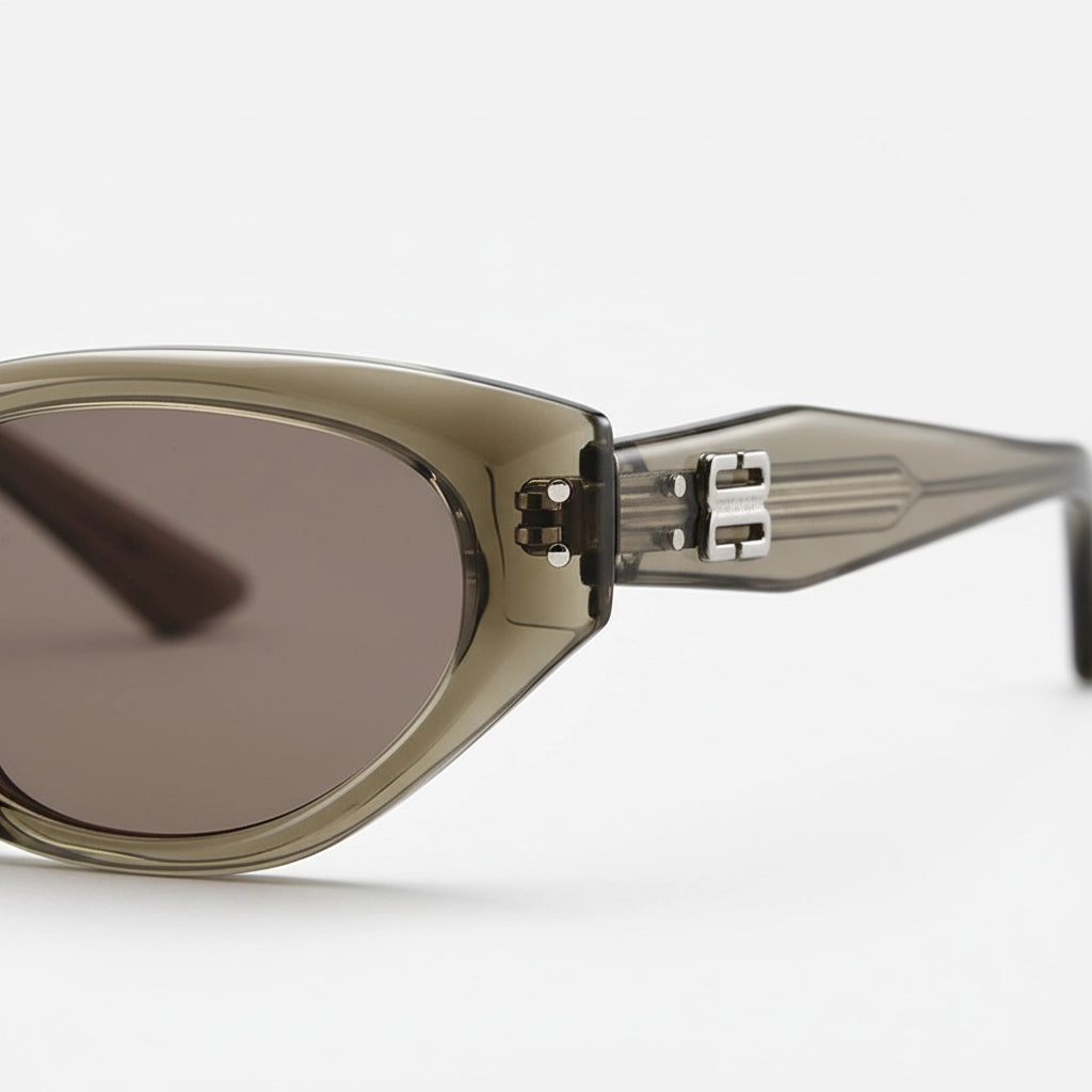 Sunglasses with a metallic frame and dark lenses on a white background