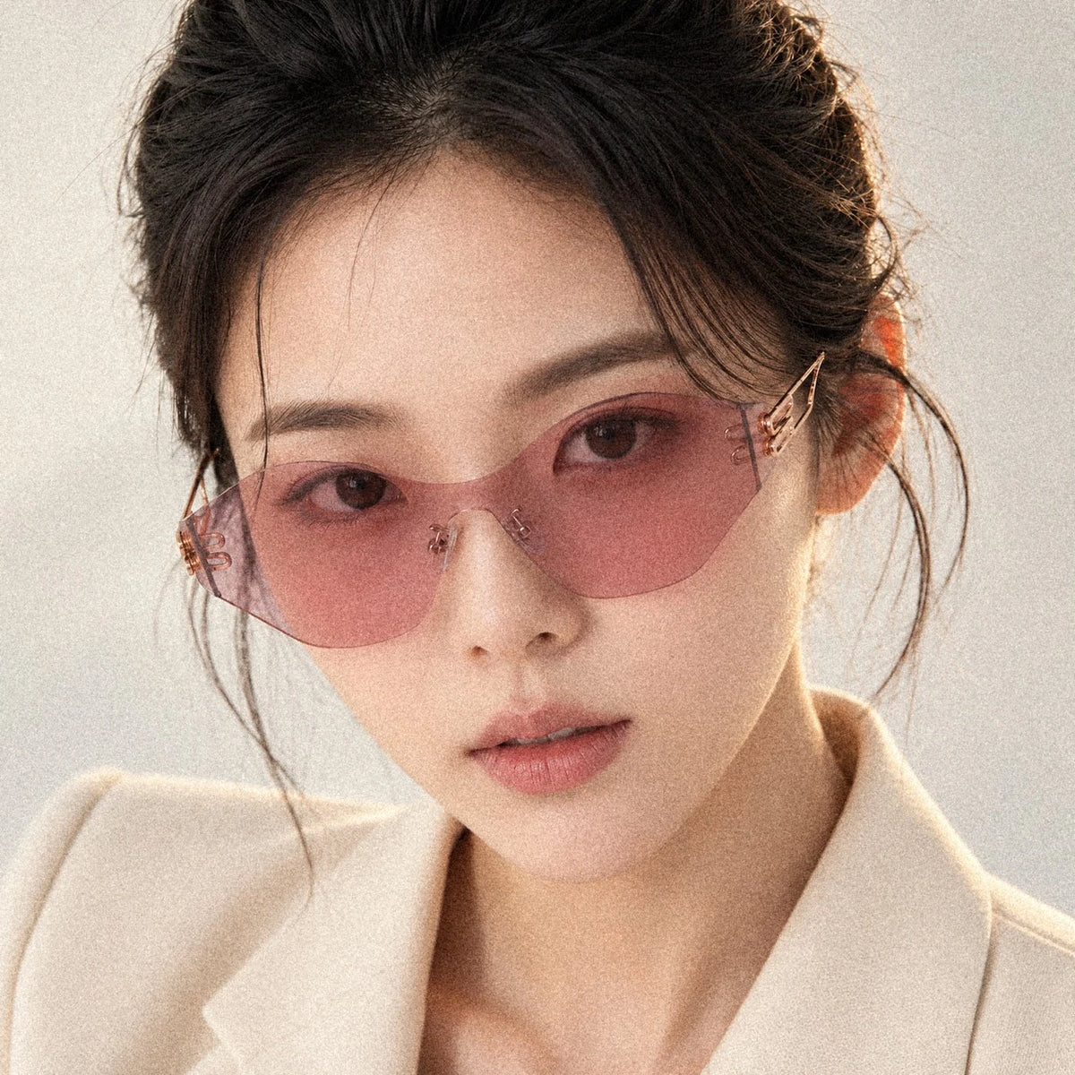 BAPORSSA Vanguard rimless shield sunglasses in Pink, worn by a model, close up
